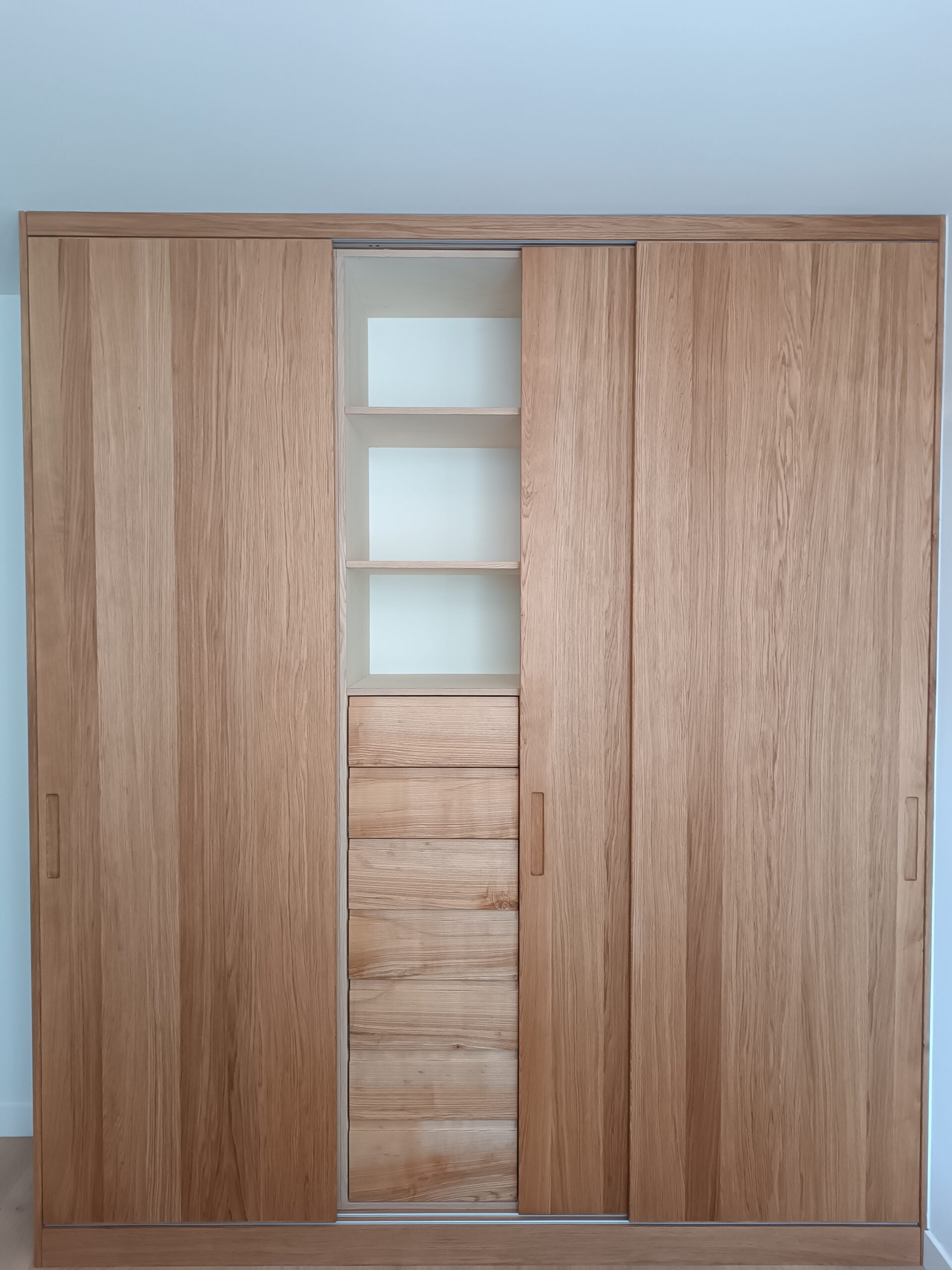 Custom-made oak veneer cabinet with sliding doors