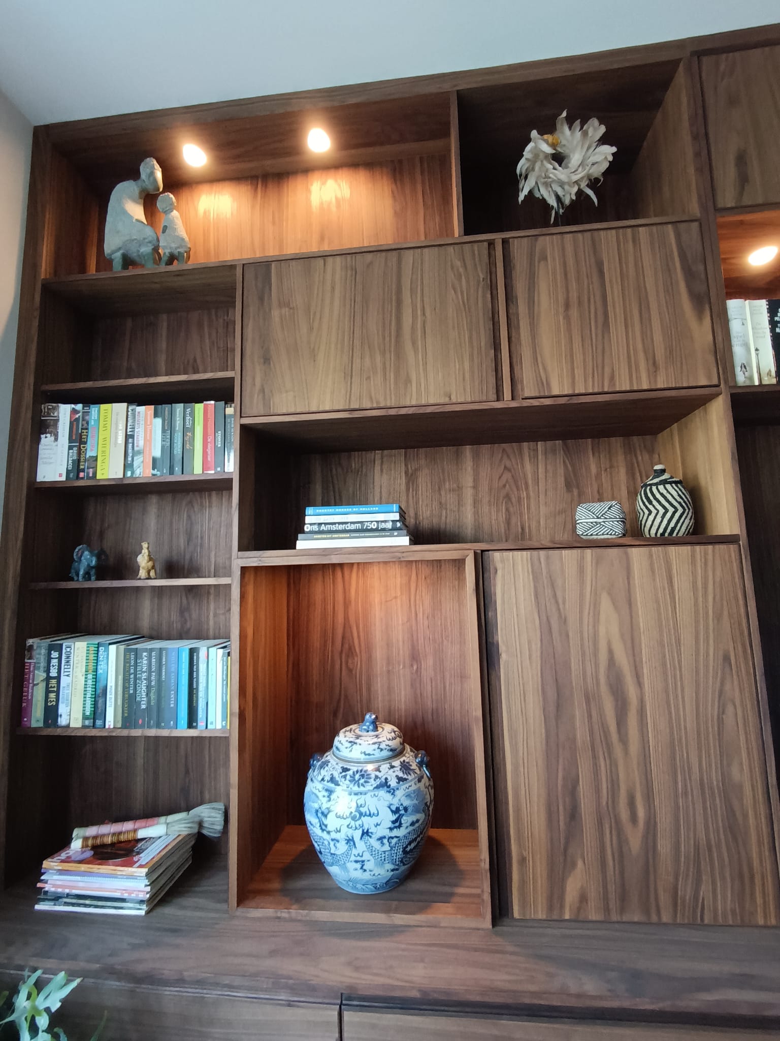 Custom-built walnut wall unit, shelf close-up