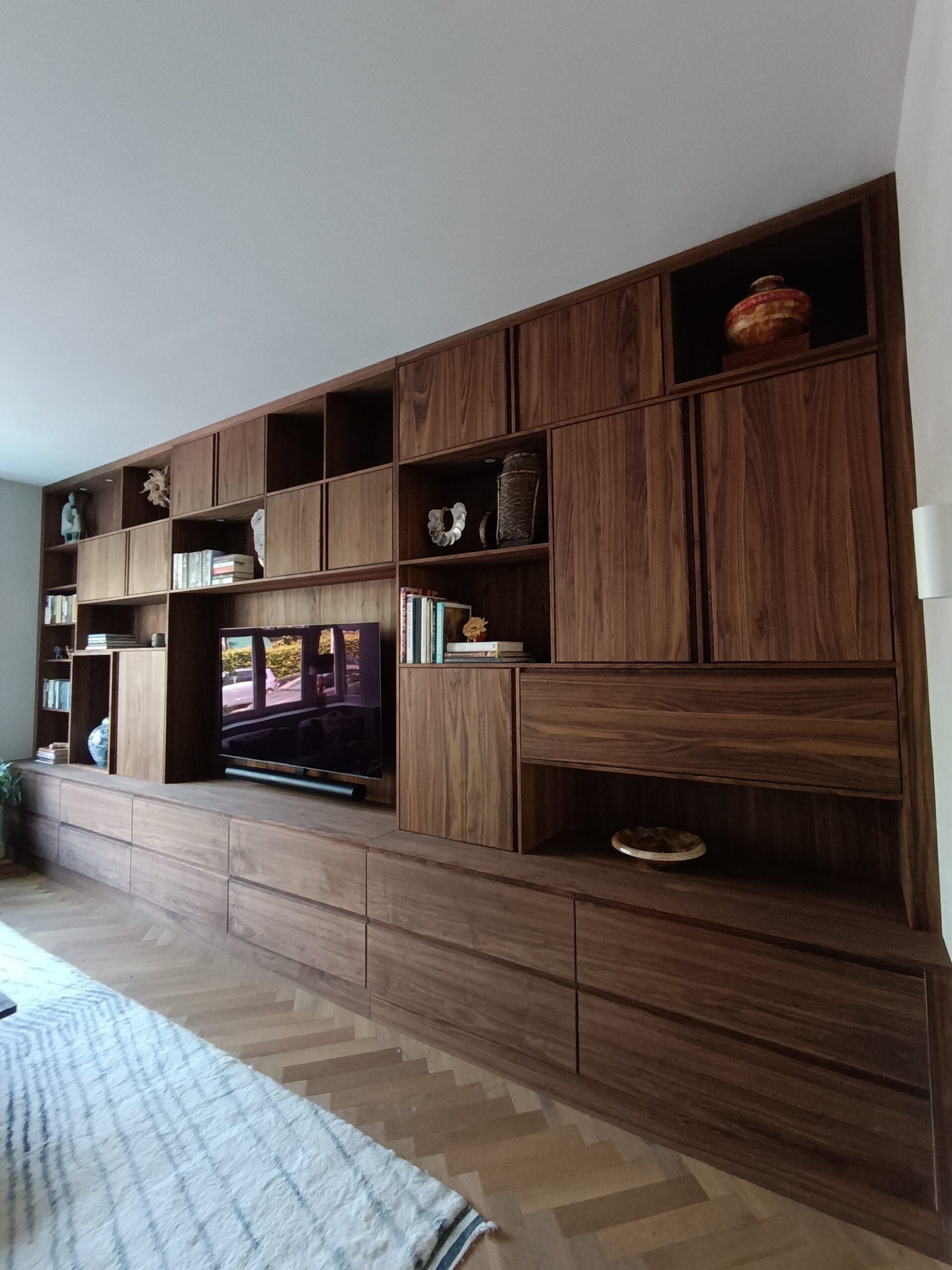 Custom-built walnut wall unit, full room view