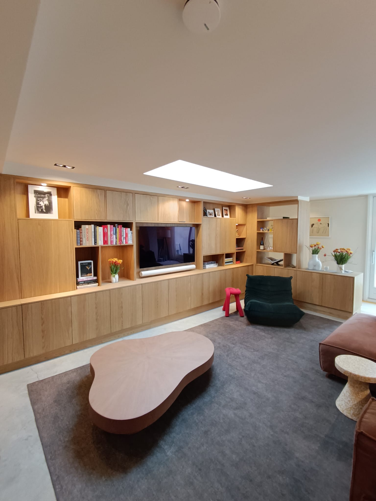 Custom oak library cabinet with open shelving and closed doors