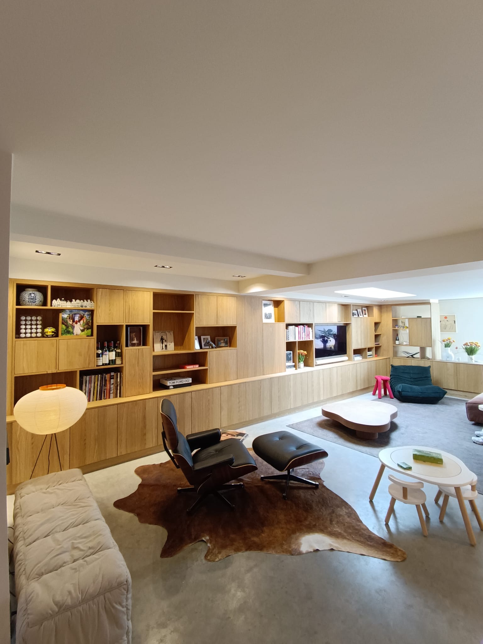 Custom oak TV and library cabinet full room vie
